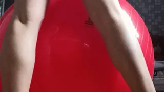 girl in lingerie jumping on red gymball