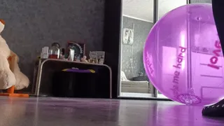 girl in leggins riding on purpure ball