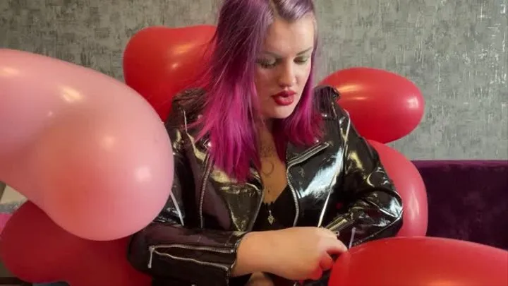 Girl in latex poping hearts balloons