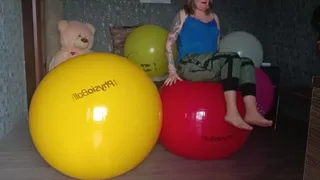 girl jumping on physio balls yellow and red
