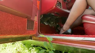 Sexy black nylons and black heals revving the relentless old ford!