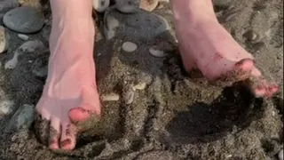 Small dirty feet on the beach