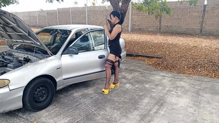 A very sexy mechanic wearing stockings and pumping a car pedal (3)