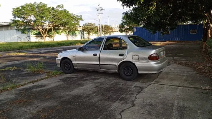 Trying to start car and drive it using huge heels (3)