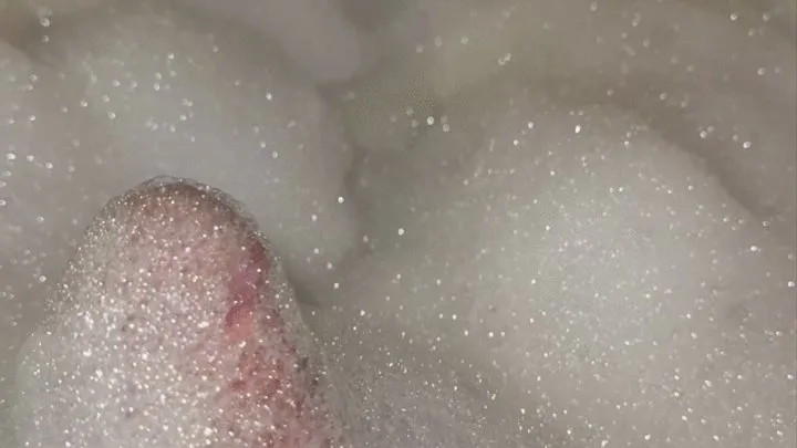 Playing with bubbles in the bathtub