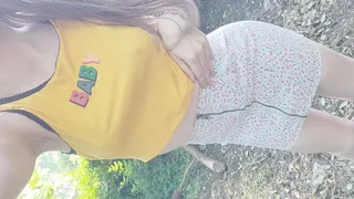 Tinylittlebabyg strips off her floral mini skirt and vest top outside to show off her pampers