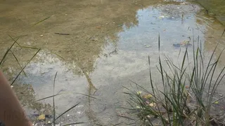 Fifi walking and splashing in the creek in black knee high boots to see how waterproof they are they