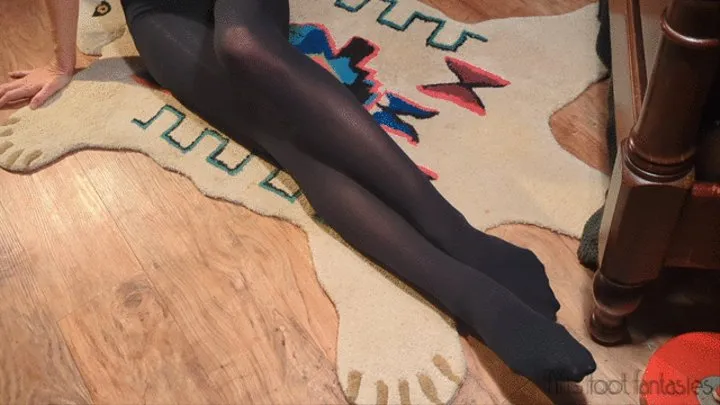 Fifi ties her black pantyhose tights to her bedpost and struggles to crawl out of them on her floor