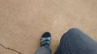 Fifi pedal pumping in Teva hiking sandals with socks and blue jeans