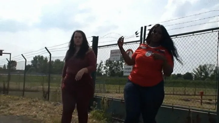 Curvy black + white women in skintight red pants, blue jeans and on high heels again