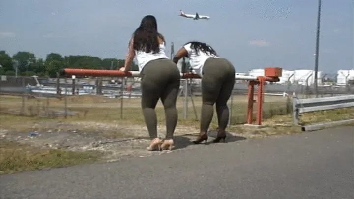 2 Curvy black + white women in skintight olive Fashionova pants and on high heels 2