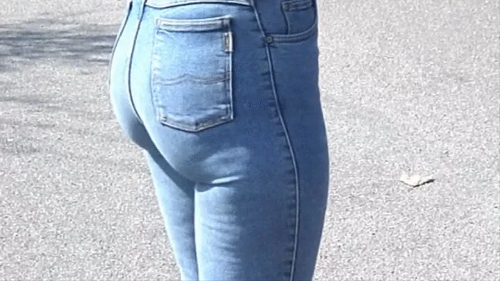 Blonde long haired girl in skintight blue Mustang Stretchjeans and on high heels 2