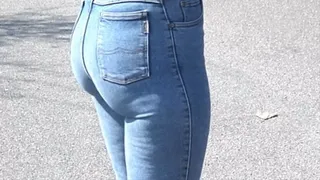 Blonde long haired girl in skintight blue Mustang Stretchjeans and on high heels 2