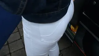 Blackhaired girl in skintight white Mustang Stretchjeans and on high heels 2