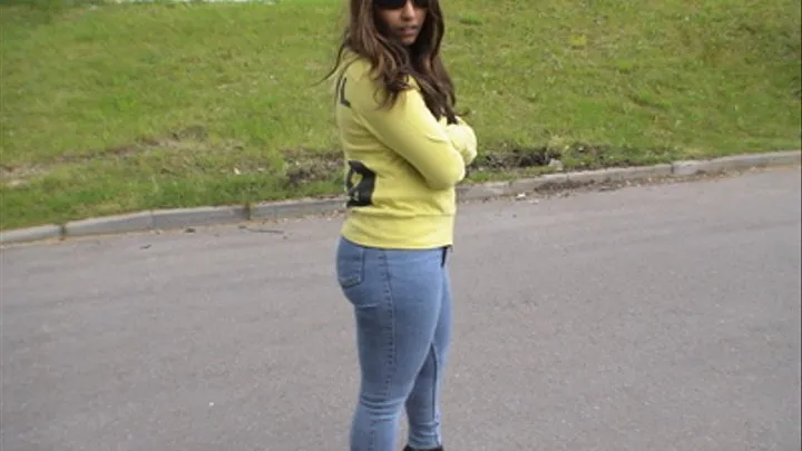 Nevra walking in skintight Mustang jeans and high heels