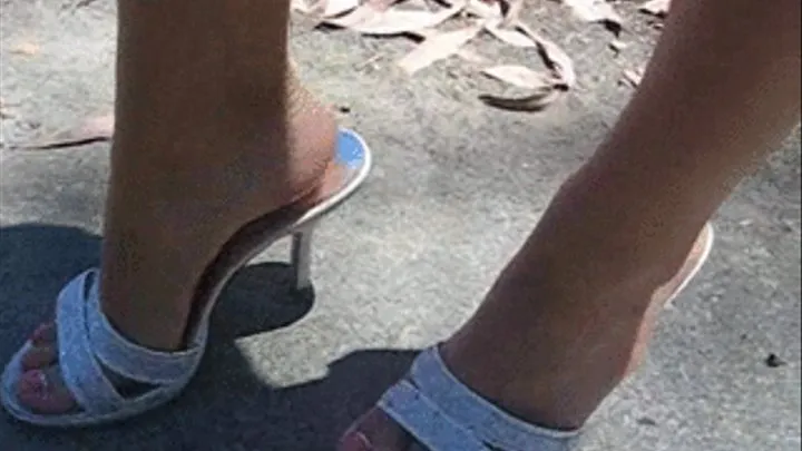 Danielles feet in white sandals