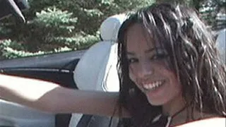 Latina has the top down and her tits out while playing with herself in the car - part 2