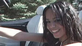 Latina has the top down and her tits out while playing with herself in the car - part 1