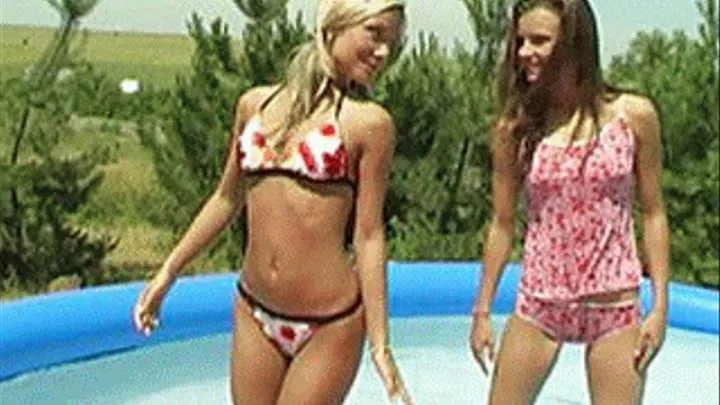 Girls having their first hole-stuffing experience in an above ground pool - high