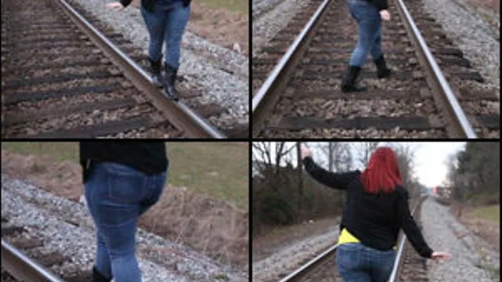 Scarlet Playing on the Train Tracks in Cowgirl Boots