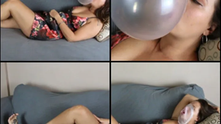 Jane Domino Blowing Bubbles Lying Down in Short Dress