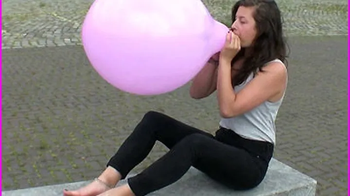 Christin blows up a Balloon until it Pops