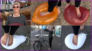 Barefoot Dreadlocked Hippie Woman Tora pops Balloons on the Street