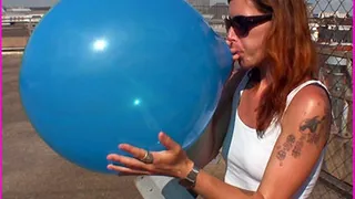 Jessica Blows-to-Pop a stubborn blue Balloon