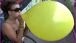 Sheila blows up a Balloon till it Pops