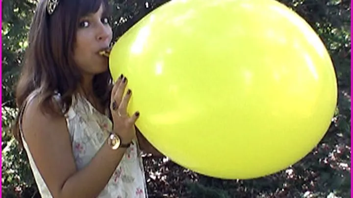 Simin blows up Balloons and pops them
