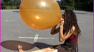 Tara blows up a Balloon until it Pops