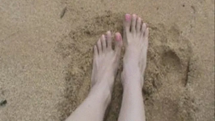 Barefeet in the sand on the beach