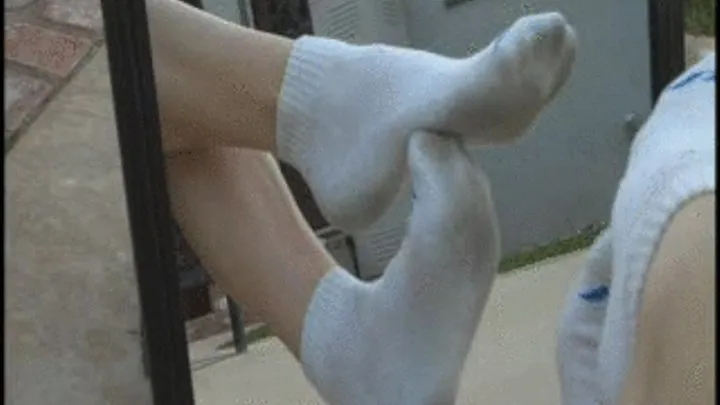 Taking off dirty socks & showing soles