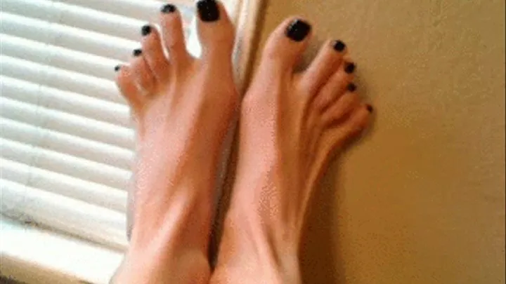 Toe wiggling with black toe nails