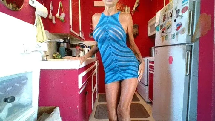 Devil Strips out of a Blue Dress in a Red Kitchen