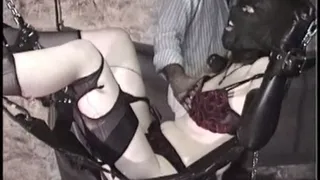 Hooded and penis gagged in the sex swing part 1