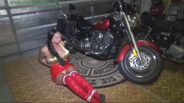 Busty Asian biker chick captured spying for a rival club