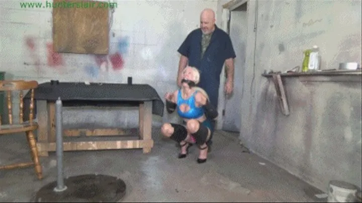 Busty blond MILF taped up tight on the girlie-go-round