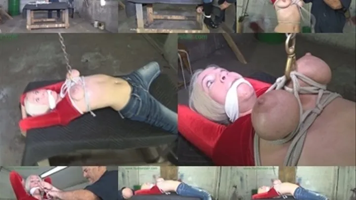 Tied down on a table with her big tits brutally bound and stretched in ropes