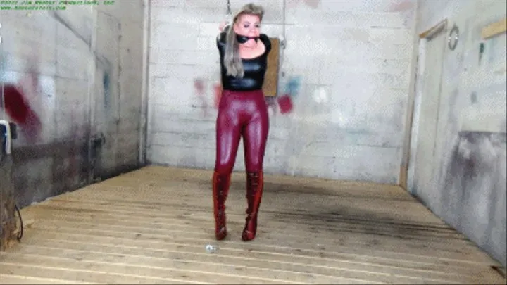 Sexy blonde captive stretched up in a sinister strappado