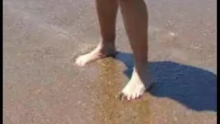 Blonde MILF barefoot in the surf