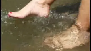 Splashing feet in cold river