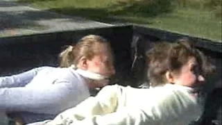 2 girls Hogtied in Bed of truck while driving down the road