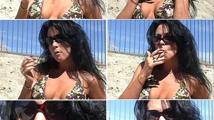 Gina smokes a marlboro red in the sun