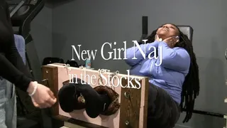 New girl Naj tickled in the stocks!