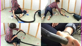 Nova vacuums the floor barefooted