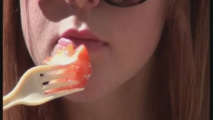 girl eating a sallad on out site caffee