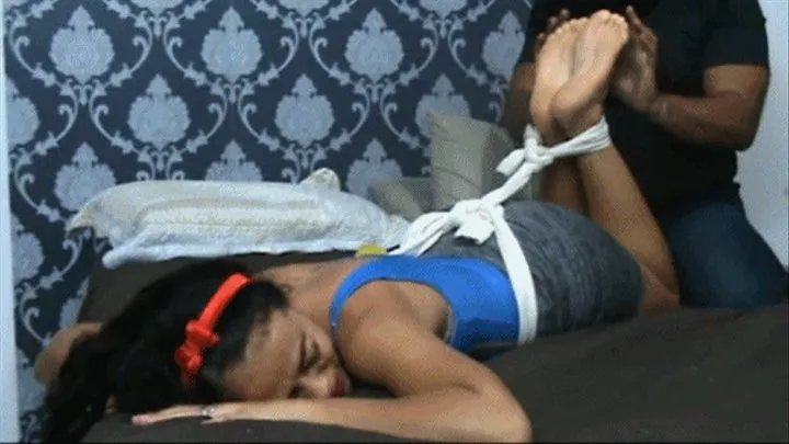 Mariana in hogtie tickling position