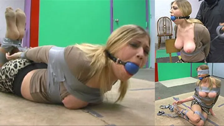 Hogtaped and Ball Gagged