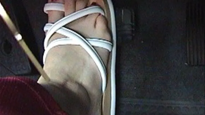 Driving in white thong sandals: Trina